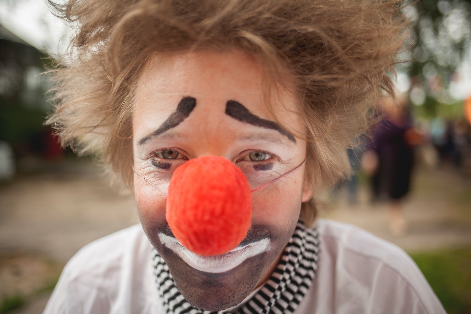 Our Legal Team - Picture of an up-close sad clown